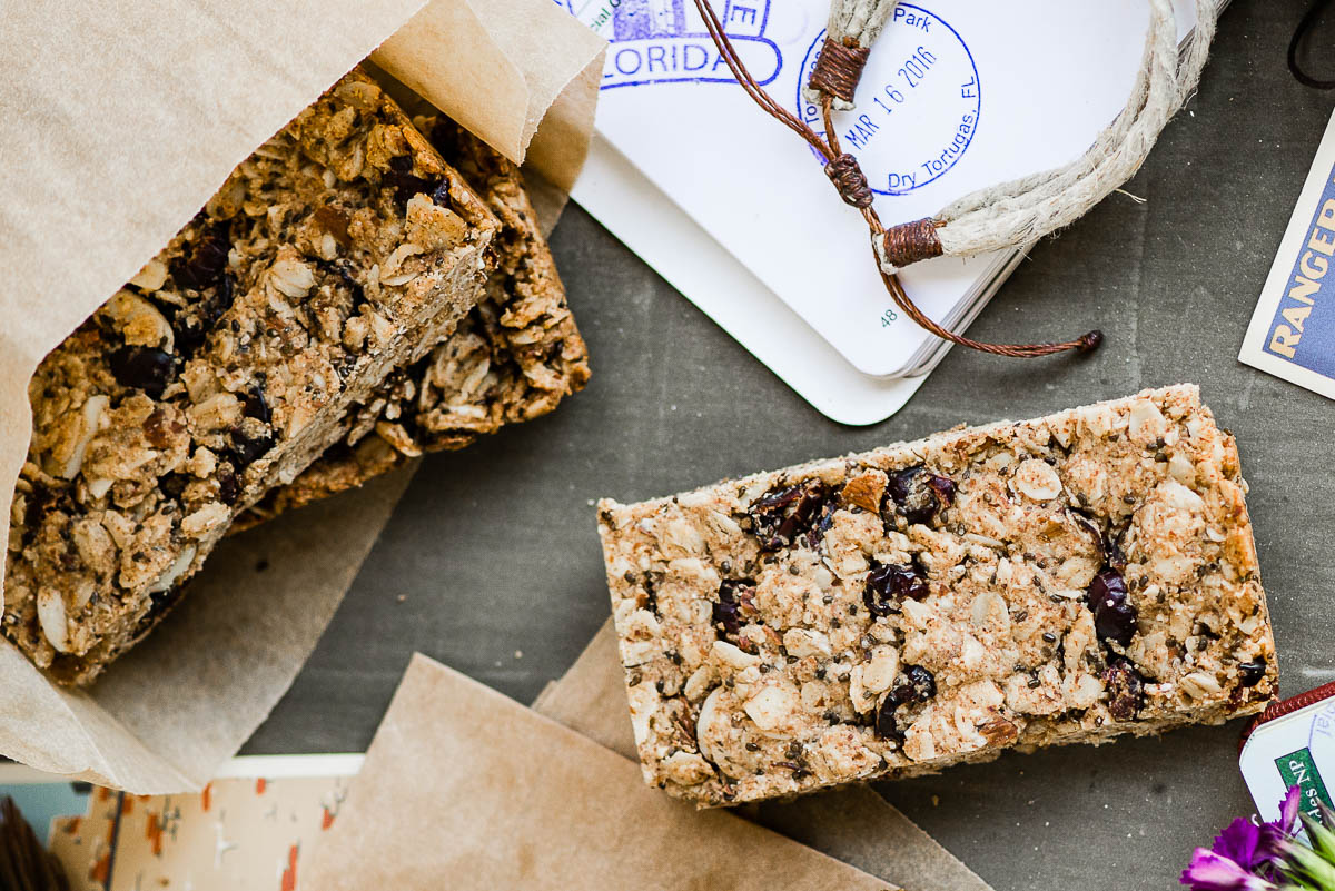 several vegan protein bars wrapped in parchment paper.