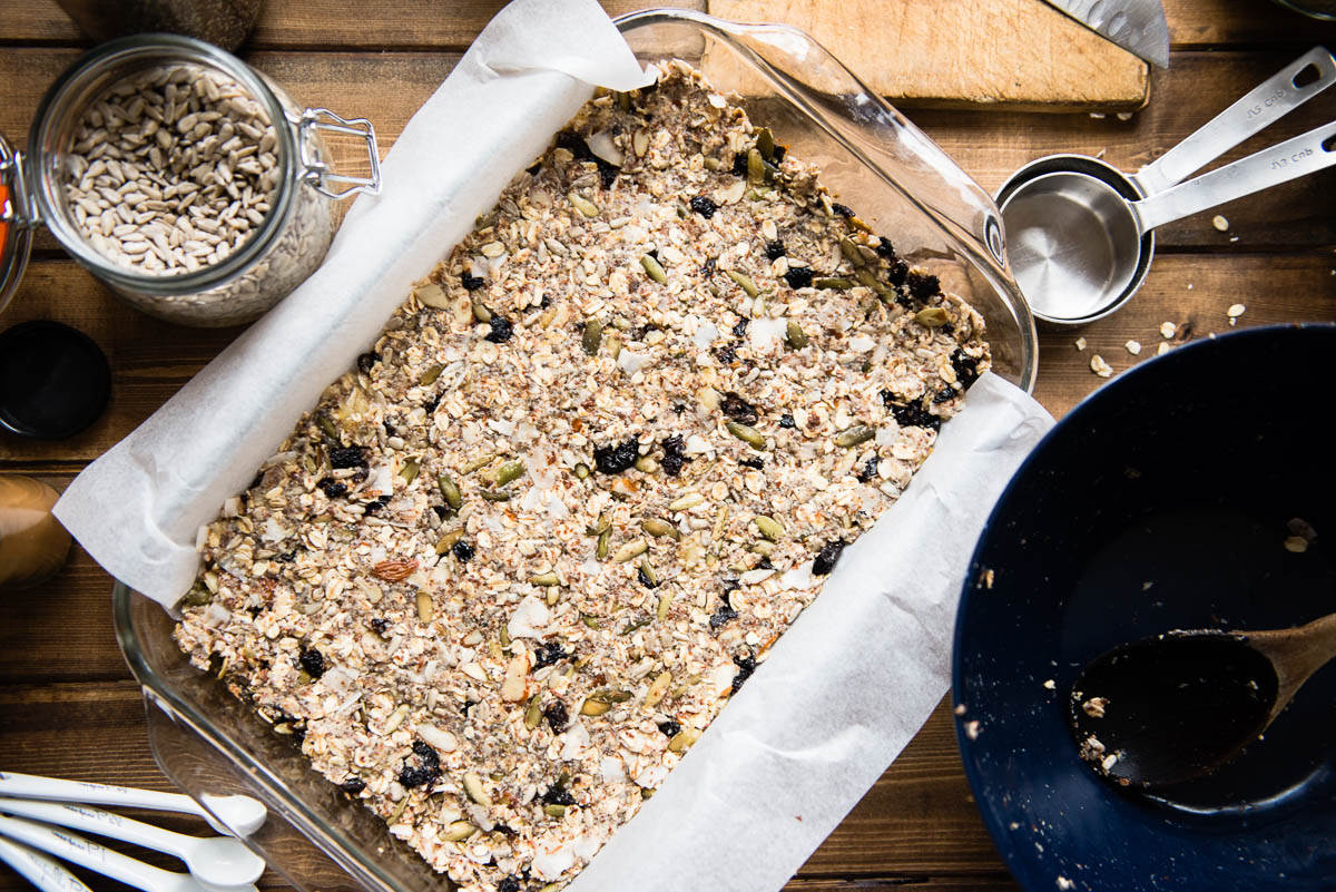 baked bars in a glass baking dish lined with parchment.