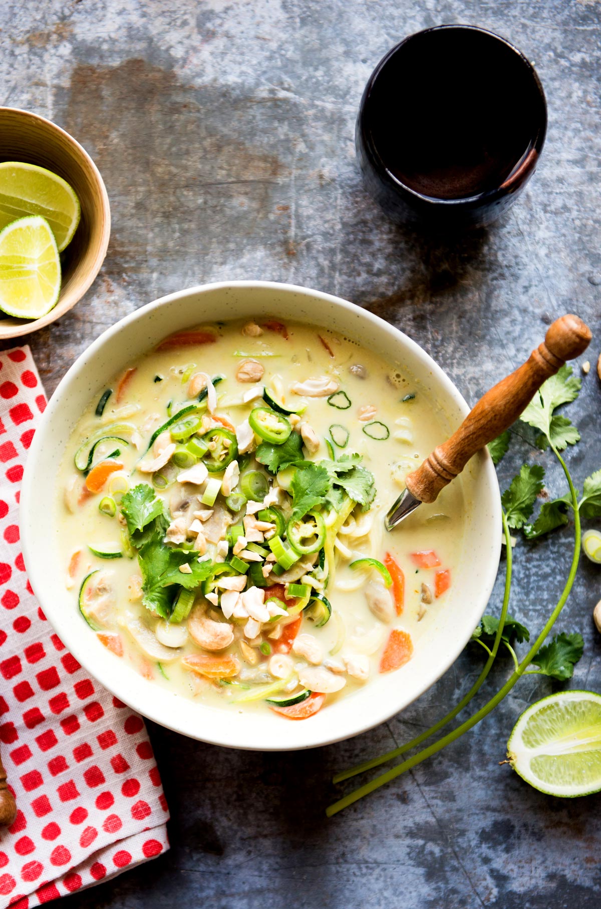 overhead shot of white bowl of vegan thai coconut soup.
