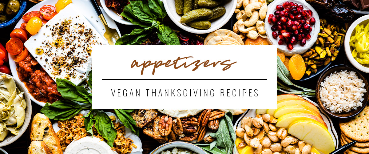 white text box that says appetizers, vegan Thanksgiving recipes overtop a vegan charcuterie board.