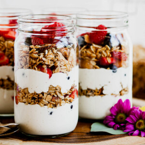 photo of 3 glass jars full of vegan yogurt parfaits