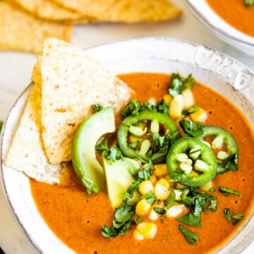 vegetarian tortilla soup topped with fresh ingredients