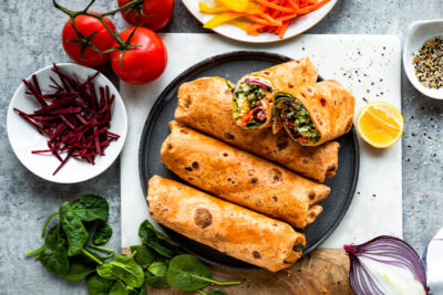 Veggie hummus wrap on sun-dried tomato tortilla.