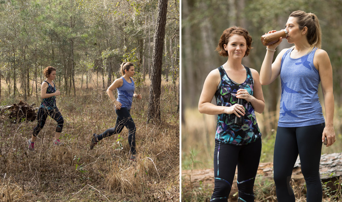 Two women running in the first with water bottles in their hands to monitor their water intake.