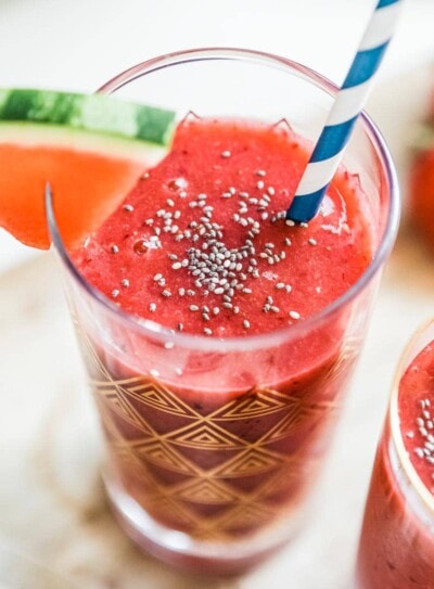 Two tall glasses of watermelon smoothie.