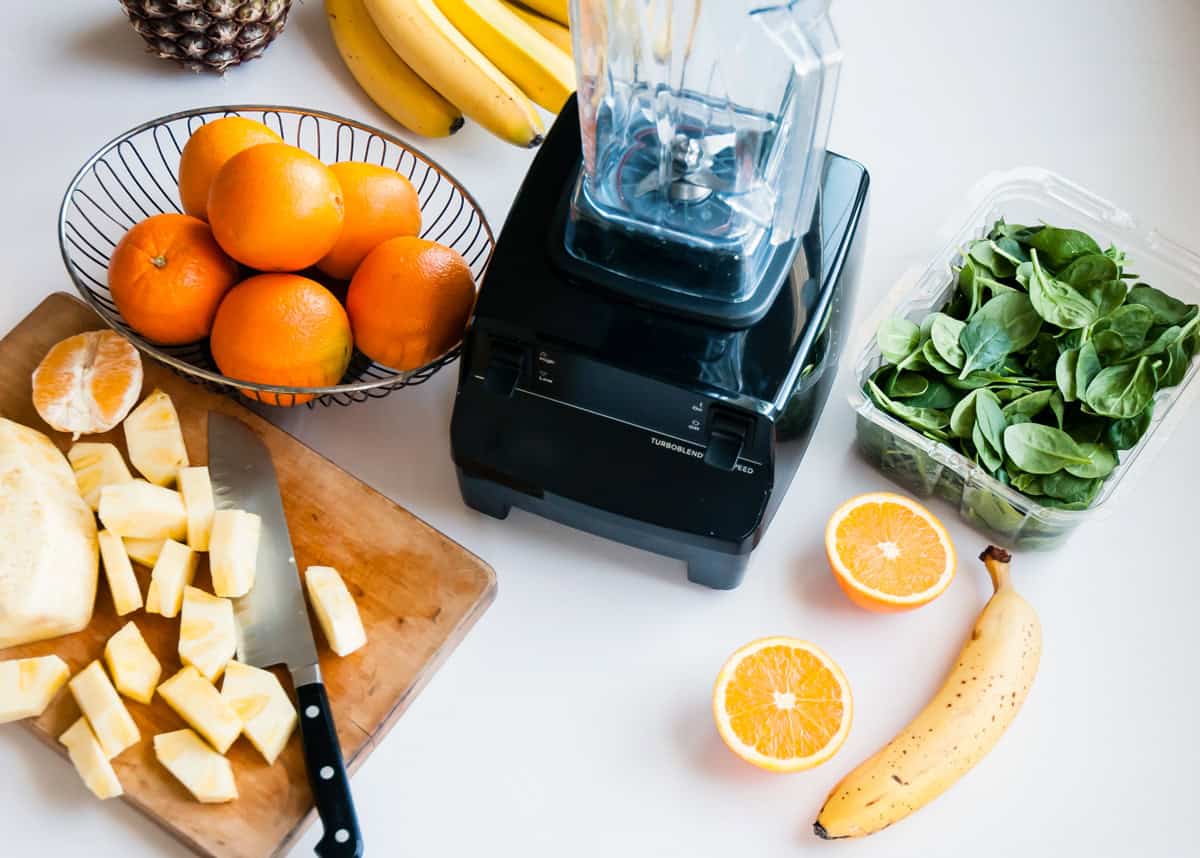 Fresh fruits and a blender for healthy weight-loss smoothies.