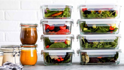 glass meal prep containers stacked with cleanse food.
