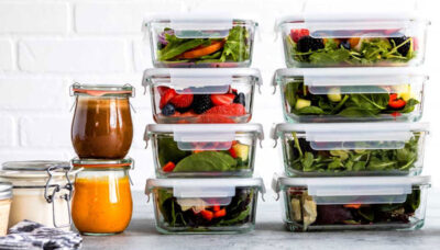 Glass meal prep containers stacked with cleanse food.